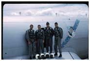U-Tapao, Thailand during the Vietnam war. My crew, left to right: John "Bear" Popular, Mike "Goose" Vairo (of St. Ignace), moi, and Tom "Big Bopper /Zorro " Davey, our aircraft commander. Them was sure interesting times.